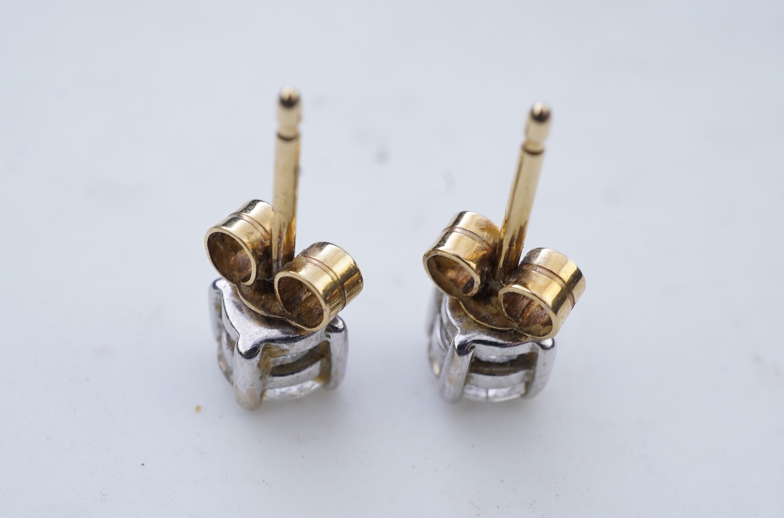 A pair of diamond stud earrings